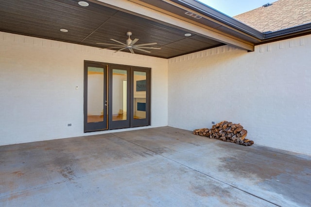 property entrance featuring a patio, ceiling fan, and french doors