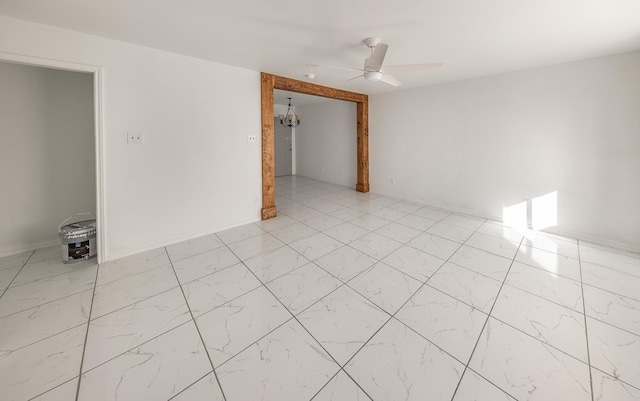 2004 Date Ave, Lubbock, TX 79404 - unfurnished room featuring ceiling fan with notable chandelier