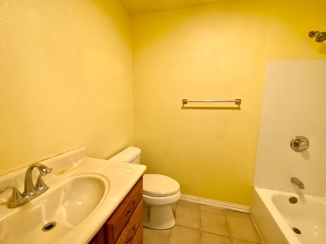 bathroom featuring tile patterned flooring, vanity, and toilet