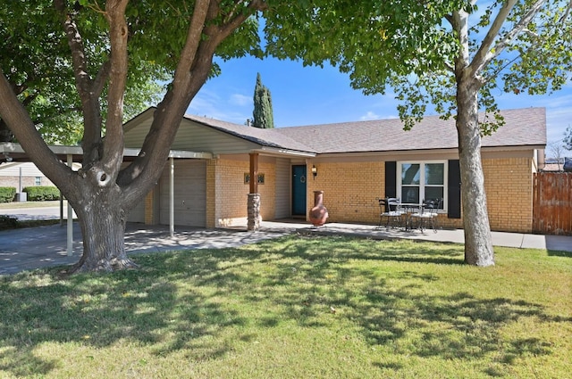 single story home with a garage and a front yard