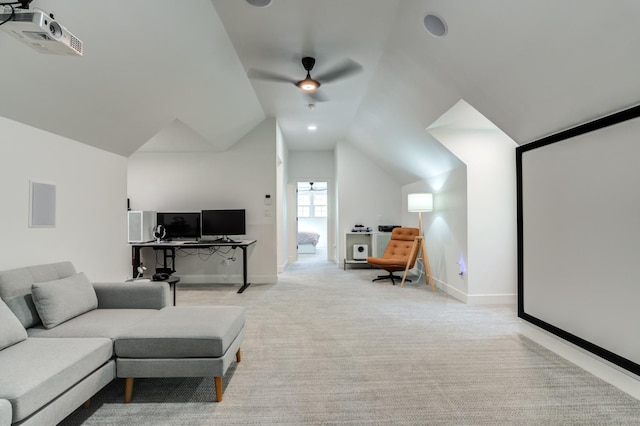 interior space with light carpet, ceiling fan, baseboards, and lofted ceiling