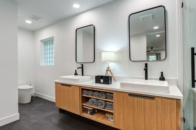 full bathroom featuring double vanity, a sink, and visible vents