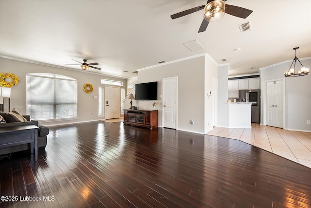 10827 Detroit Ave, Lubbock, TX 79423 - living area with a ceiling fan, crown molding, light wood-style flooring, and baseboards