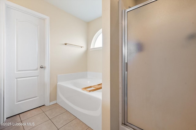 10827 Detroit Ave, Lubbock, TX 79423 - bathroom featuring a shower stall, tile patterned floors, and a bath