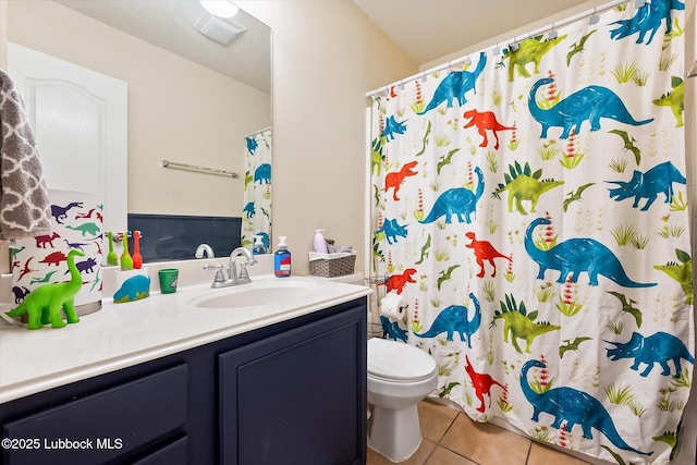 10827 Detroit Ave, Lubbock, TX 79423 - full bathroom featuring tile patterned floors, vanity, toilet, and a shower with curtain