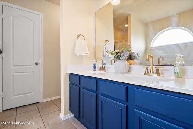 10827 Detroit Ave, Lubbock, TX 79423 - bathroom featuring double vanity and tile patterned floors