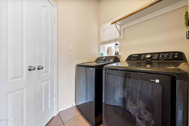 10827 Detroit Ave, Lubbock, TX 79423 - laundry area featuring separate washer and dryer and tile patterned flooring