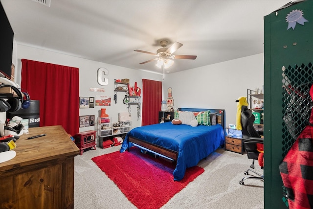 bedroom featuring a ceiling fan and carpet