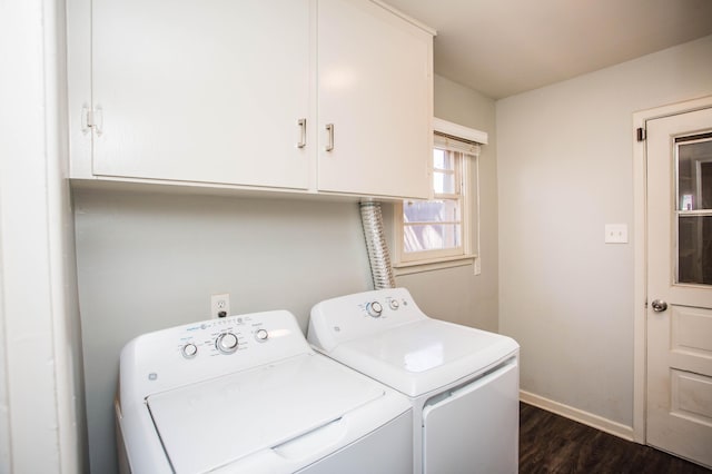 clothes washing area featuring separate washer and dryer, baseboards, dark wood-style flooring, and cabinet space