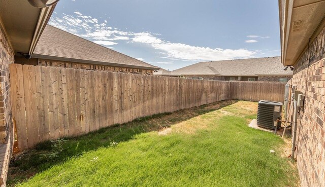 view of yard with central AC