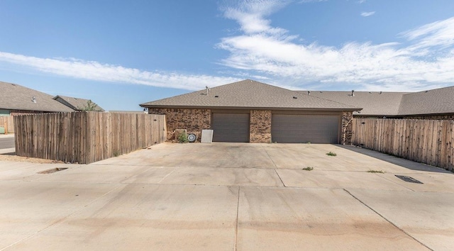 view of side of home featuring a garage