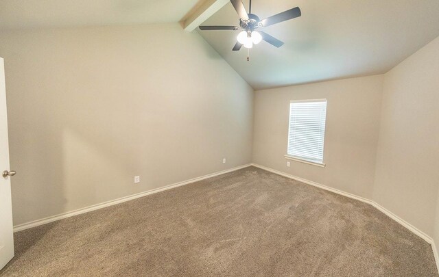 spare room with vaulted ceiling with beams, ceiling fan, and carpet