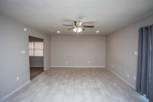 spare room with ceiling fan