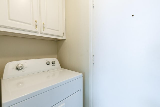 laundry room with washer / dryer and cabinet space