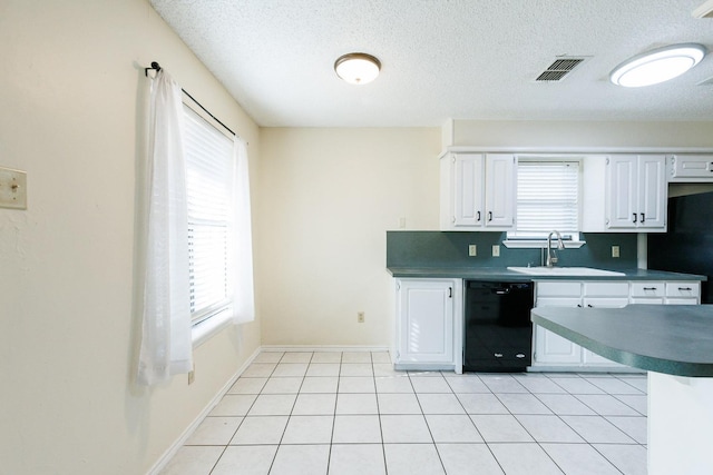 kitchen with visible vents, dishwasher, light tile patterned floors, white cabinetry, and a sink