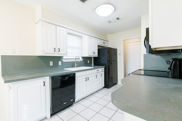 kitchen with black appliances, white cabinets, visible vents, and a sink