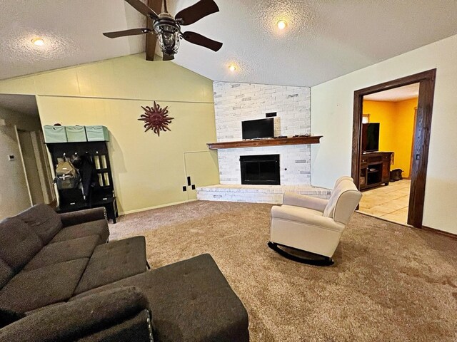 carpeted living room with lofted ceiling, a brick fireplace, a textured ceiling, and ceiling fan