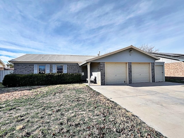 ranch-style house featuring a garage