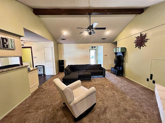 living room featuring ceiling fan, lofted ceiling with beams, a textured ceiling, and dark colored carpet