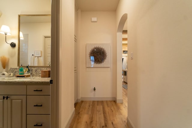 bathroom with hardwood / wood-style flooring and vanity