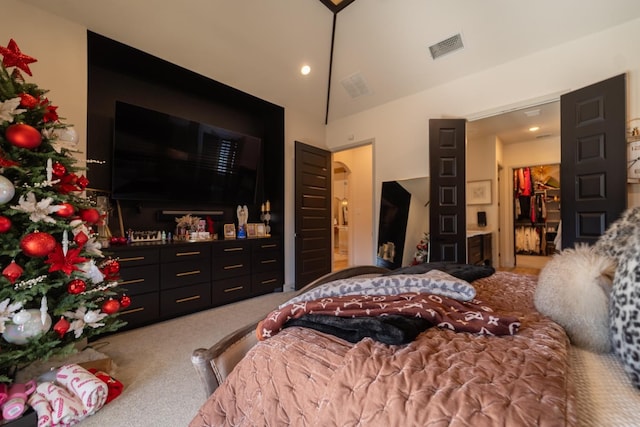 bedroom with vaulted ceiling and carpet floors