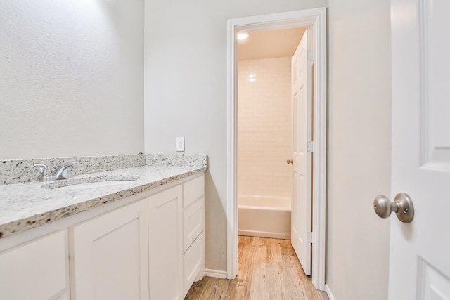 bathroom featuring vanity and hardwood / wood-style flooring