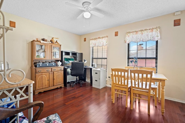 home office featuring ceiling fan, dark hardwood / wood-style floors, and a textured ceiling