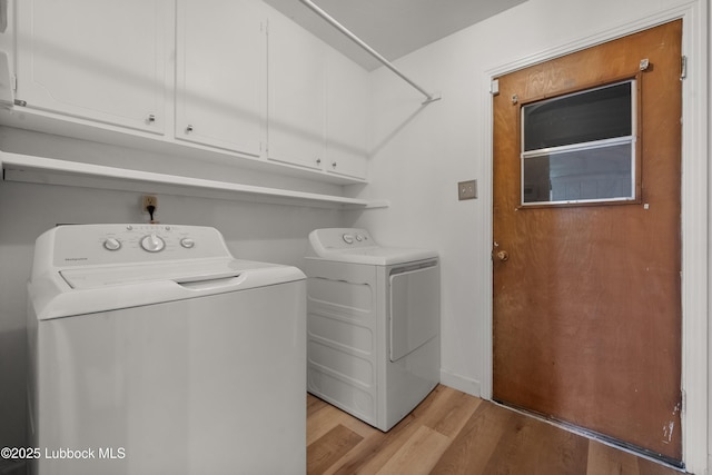 6405 Joliet Ave, Lubbock, TX 79413 - laundry room featuring washer and dryer, cabinet space, and light wood-style floors
