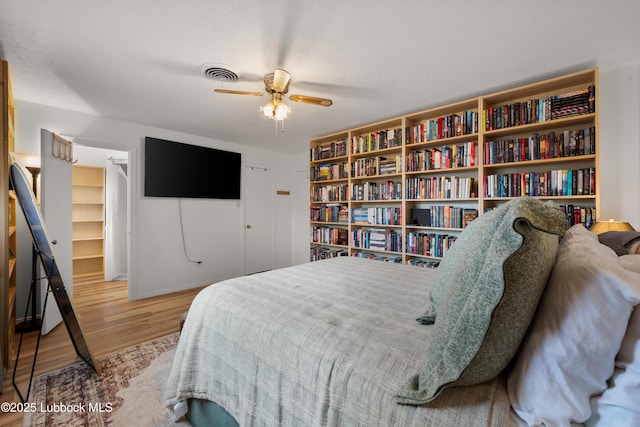6405 Joliet Ave, Lubbock, TX 79413 - bedroom featuring wood finished floors, ceiling fan, and a closet