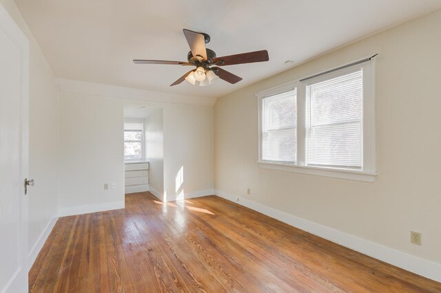 spare room with vaulted ceiling, ceiling fan, and hardwood / wood-style floors