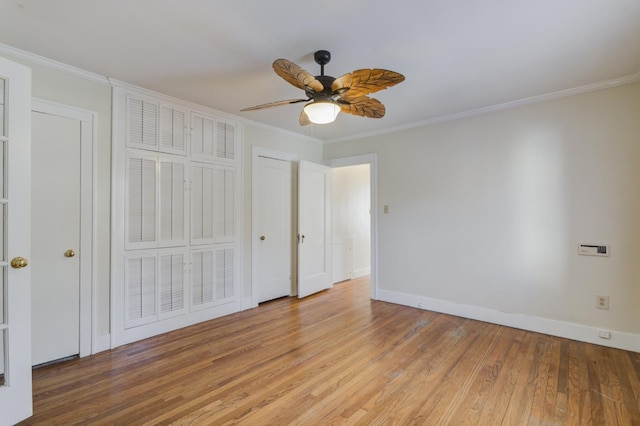 unfurnished bedroom featuring crown molding, ceiling fan, and light hardwood / wood-style flooring