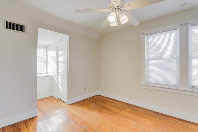 unfurnished room featuring ceiling fan, lofted ceiling, and hardwood / wood-style floors