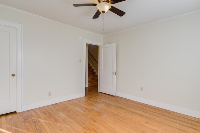 unfurnished room featuring crown molding, ceiling fan, and light hardwood / wood-style flooring