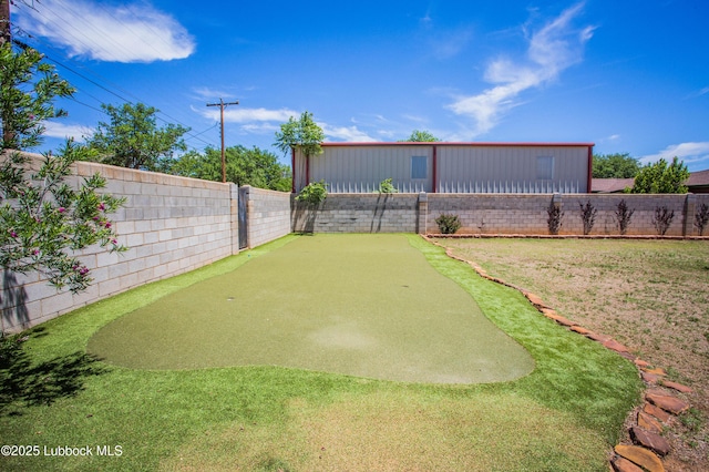 504 N 14th St, Lamesa, TX 79331 - fenced backyard with a putting green