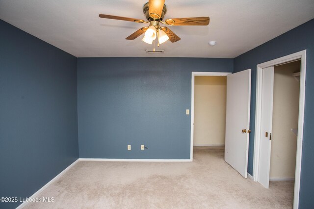 504 N 14th St, Lamesa, TX 79331 - unfurnished bedroom with carpet, baseboards, and a ceiling fan