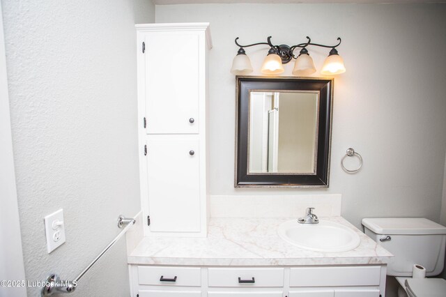 504 N 14th St, Lamesa, TX 79331 - bathroom with vanity and toilet