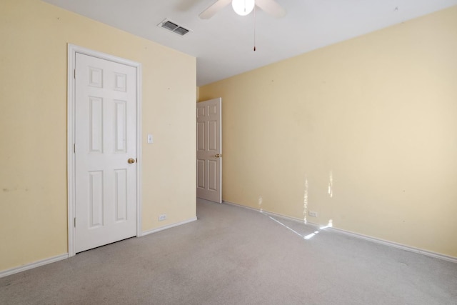 unfurnished bedroom with light carpet and ceiling fan