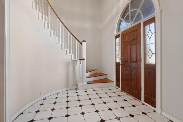 foyer with a towering ceiling