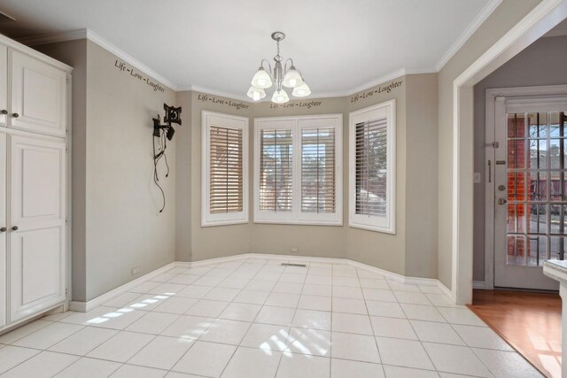 unfurnished dining area featuring crown molding, plenty of natural light, light tile patterned floors, and a notable chandelier