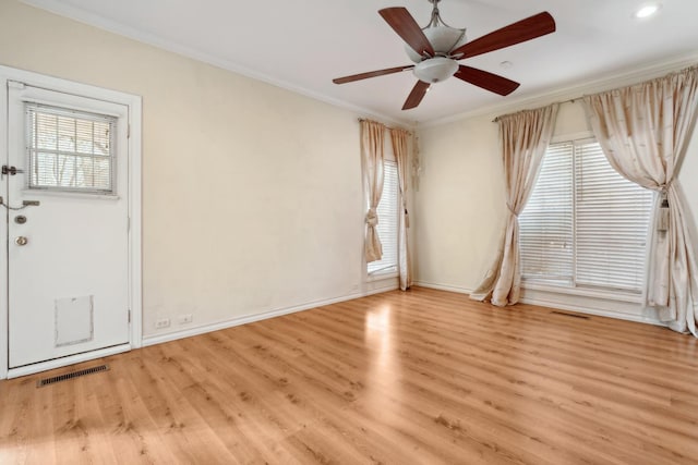 entryway featuring crown molding, ceiling fan, and light wood-type flooring