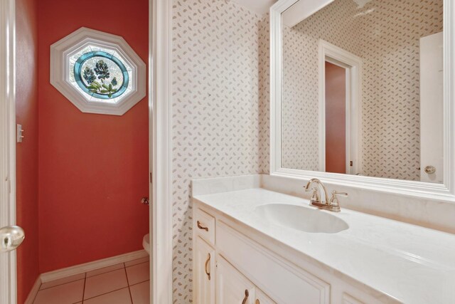 bathroom featuring vanity, toilet, and tile patterned flooring