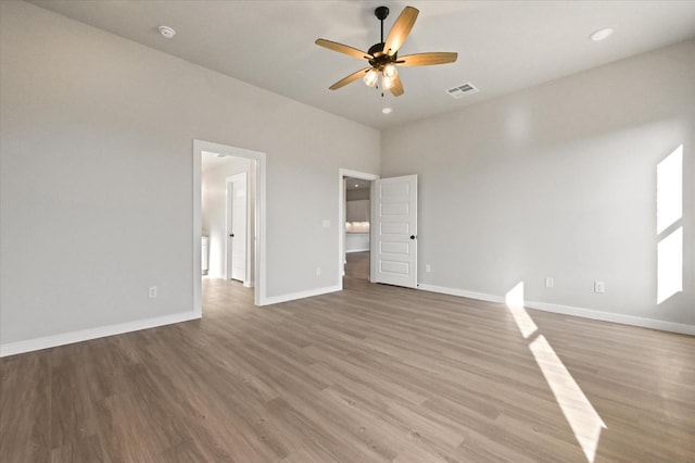 unfurnished bedroom with hardwood / wood-style floors and ceiling fan