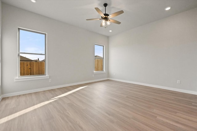 unfurnished room with light hardwood / wood-style flooring and ceiling fan