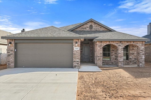 view of front of property with a garage