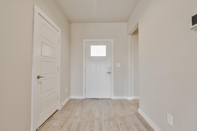 entryway with light hardwood / wood-style floors