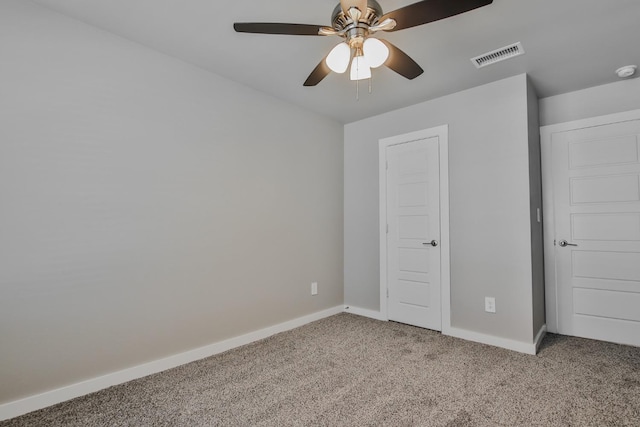 unfurnished bedroom with ceiling fan and carpet