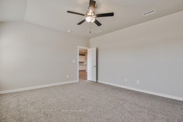 spare room with ceiling fan and carpet floors