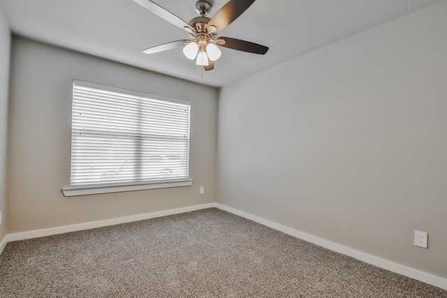 empty room with ceiling fan and carpet flooring