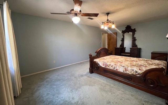 unfurnished bedroom with ceiling fan, carpet, and a textured ceiling