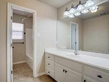 bathroom with vanity and tub / shower combination